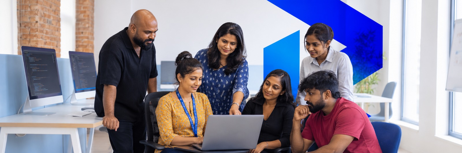 Blue Matrix team collaborating at a shared workspace